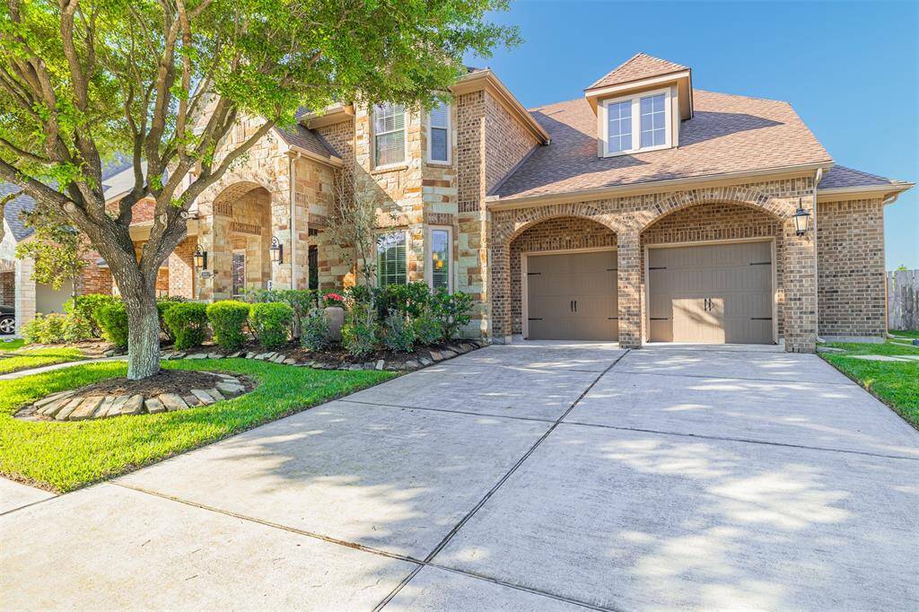 This home also features an oversized 3-car attached tandem garage with additional 1/2 car garage area that can be used as a workspace.