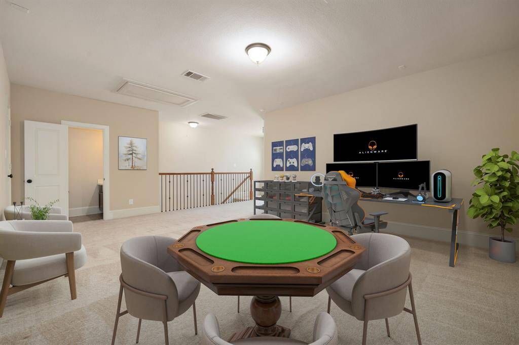 Come upstairs and enjoy a day of leisure in this fabulous game room/media room! This is the perfect hangout spot or adult game room, this space features plush carpet, high ceiling, lighting, neutral paint and convenient half bath.