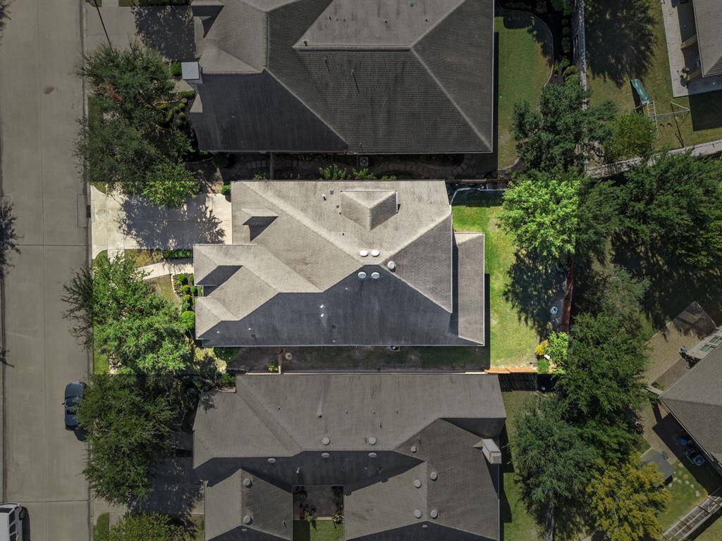 Amazing aerial shot of this gorgeous David Weekley home situated on a on a quiet street in the sought after community of Cinco Ranch zoned to Katy ISD. Lush landscaping, well manicured front lawn and a wonderful back patio, an outdoor kitchen area and a beautiful view of your spacious backyard.