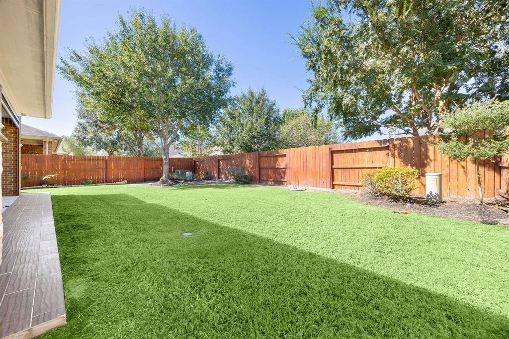 Come and see this spacious backyard! There is plenty of room for the kids to play and adults to relax!
