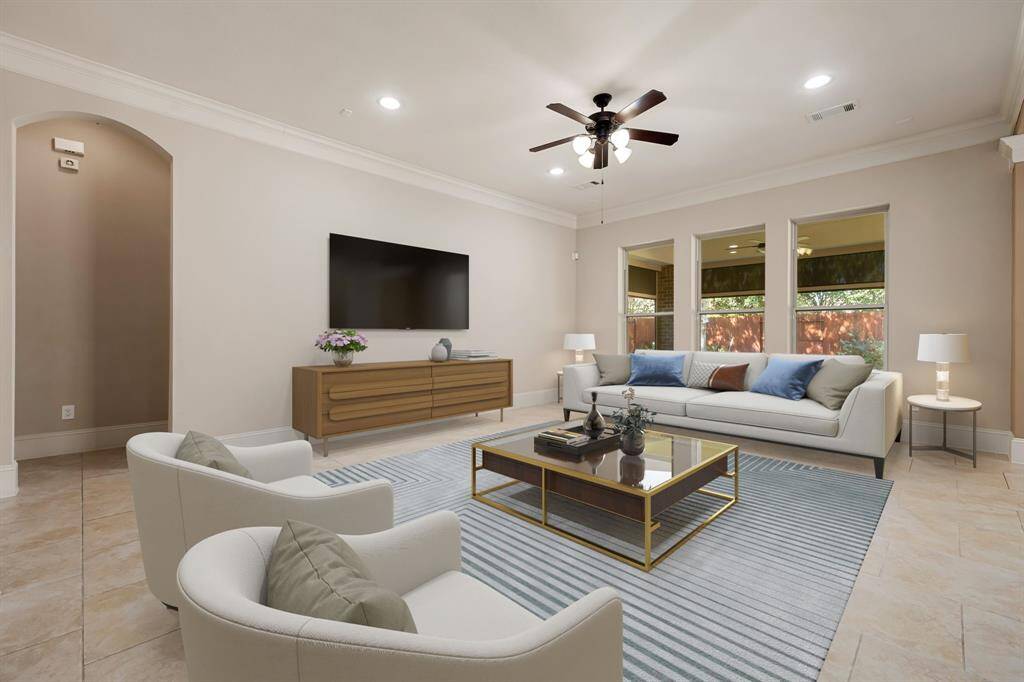 This light and bright spacious living room is the perfect layout for entertaining or just relaxing. Whether it's simply a night in or entertaining family and friends, this home has ample open space for everyone to enjoy! Featuring dark stained ceiling fan, large tile flooring, large windows, high ceilings, recessed lighting with wonderful access to your gorgeous kitchen.