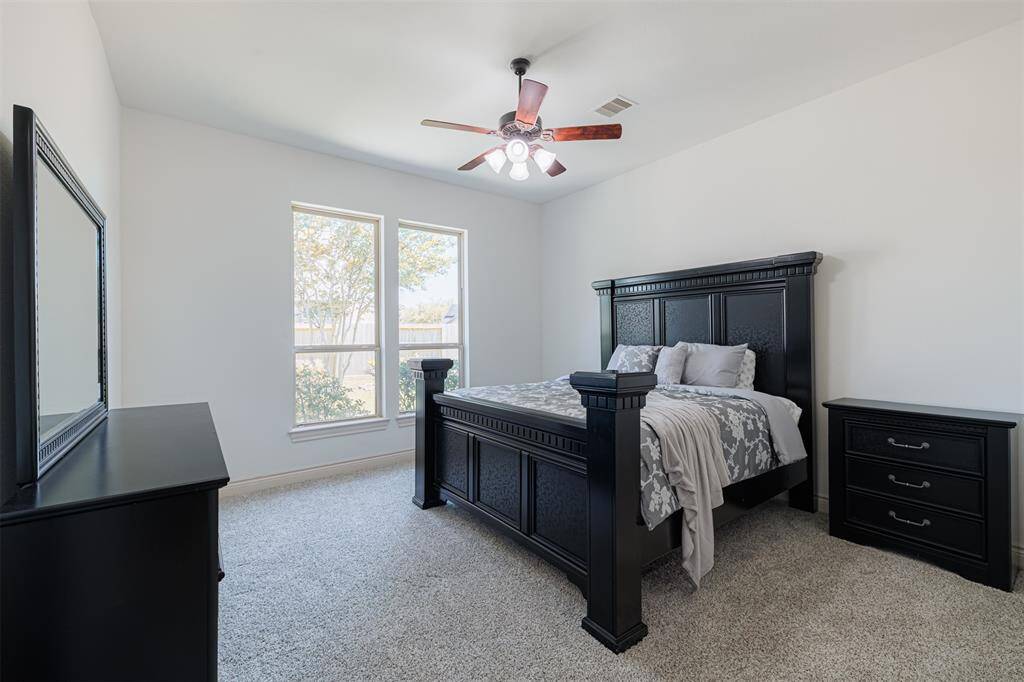 Second bedroom with private full bath located downstairs is great as a guest or mother-in-law suite.