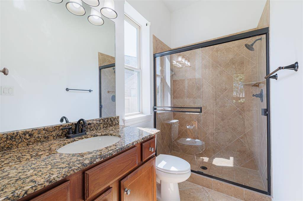 Full bath located off the guest suite downstairs.