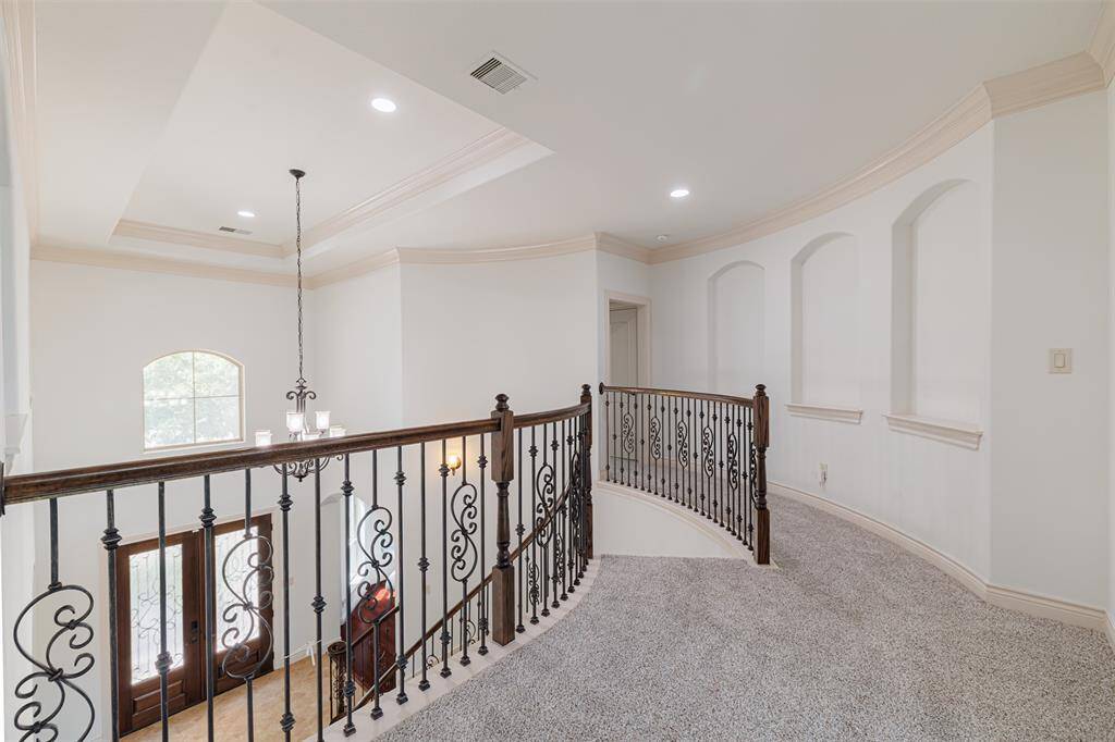 Upstairs landing with several art niches.