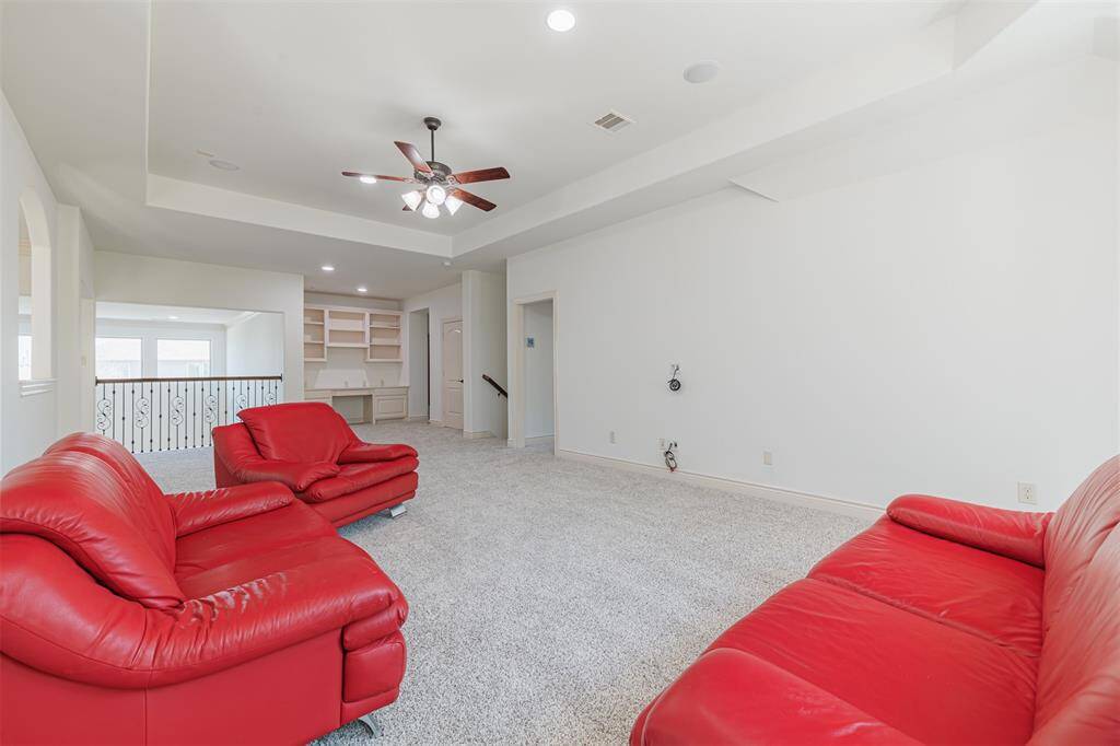 Another view of the game room looking towards the built-in desk area.