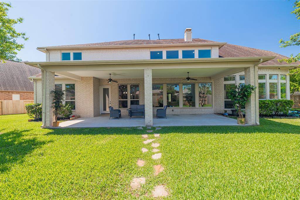 Oversized covered back patio.