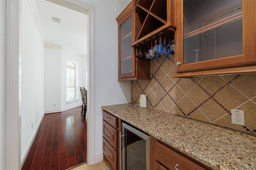 Butler's pantry located between the formal dining room and kitchen.