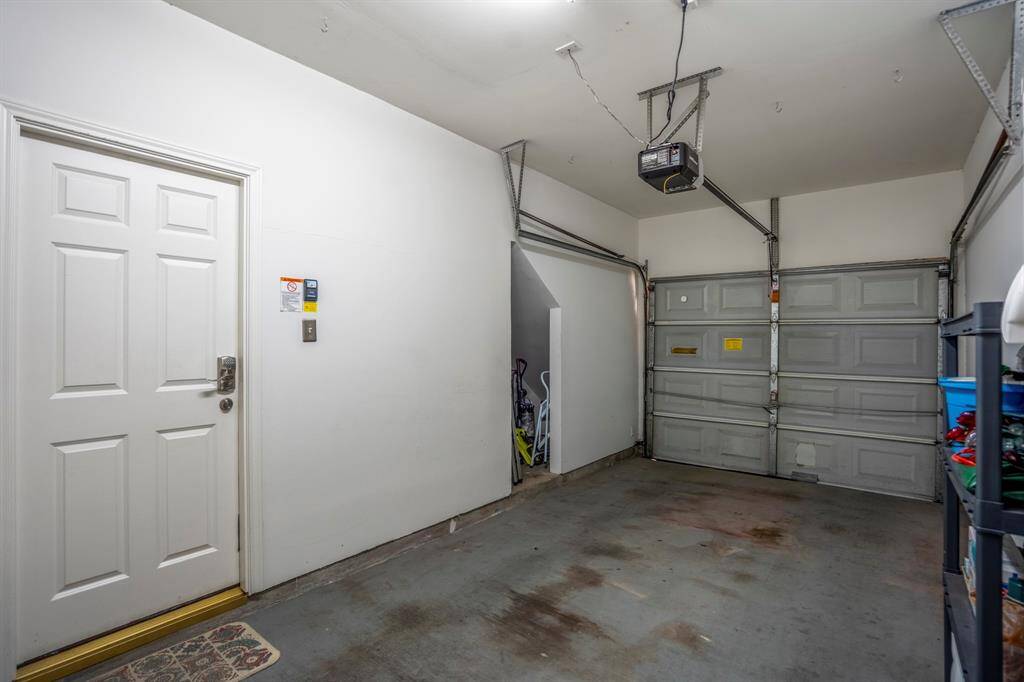 Attached garage offers ample space for parking and storage.