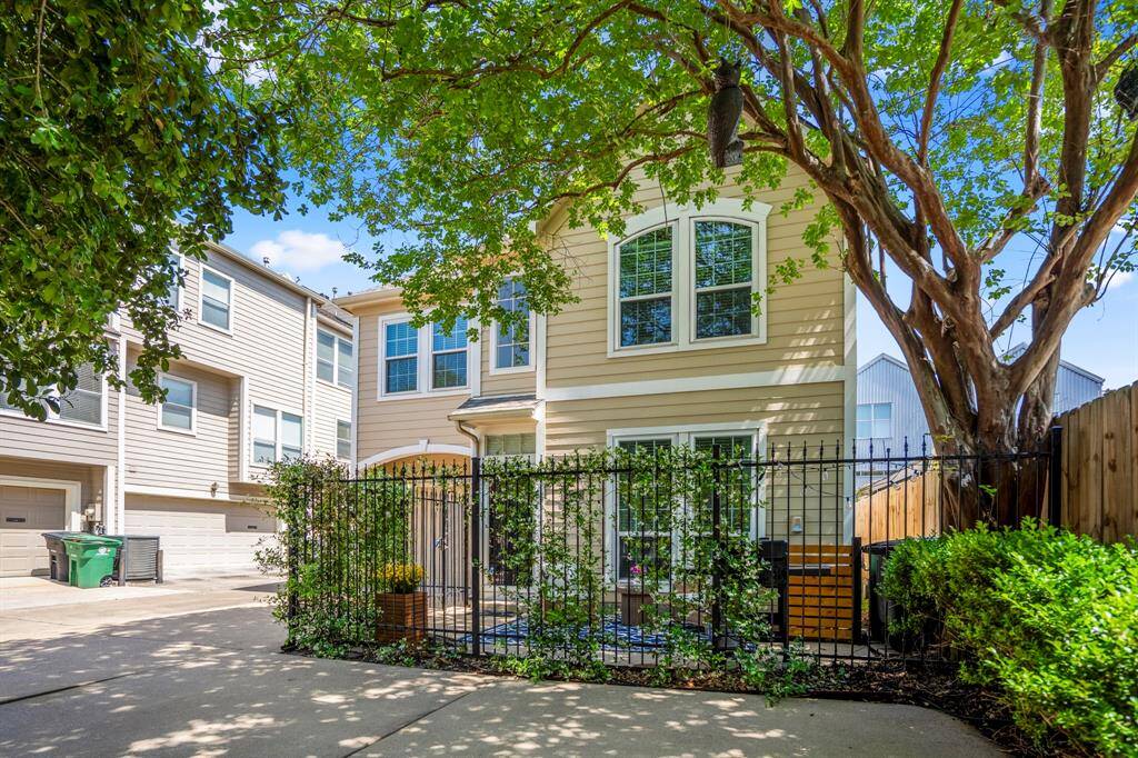 Enjoy a serene patio retreat under the cooling canopy of a shade tree.
