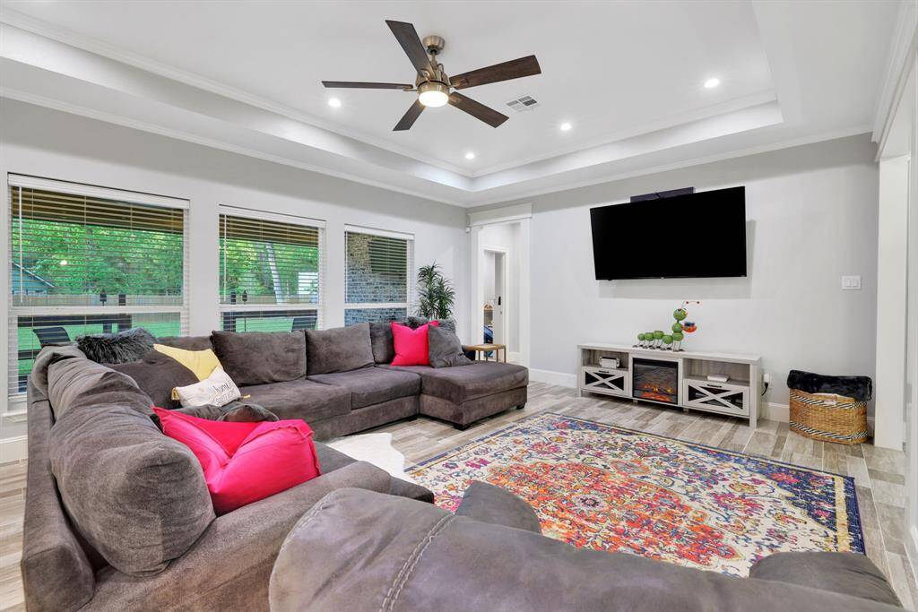 Sophisticated living space featuring gorgeous, oversized windows that invite the outdoors in.