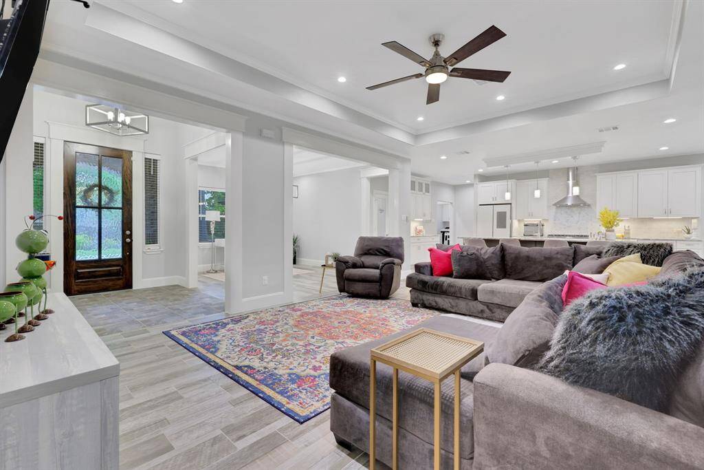 Living area exudes grace and charm with magnificent windows as its centerpiece
