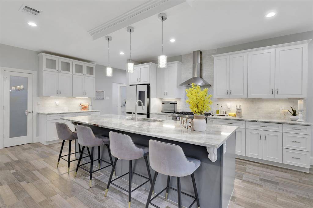 A striking view of the spacious island, designed to anchor the kitchen with both beauty and purpose.