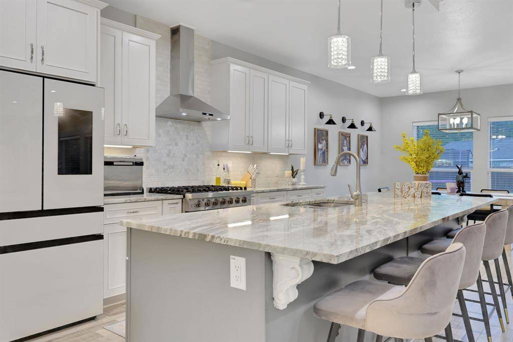 Elegant kitchen with premium appliances and a spacious island, ideal for family gatherings.