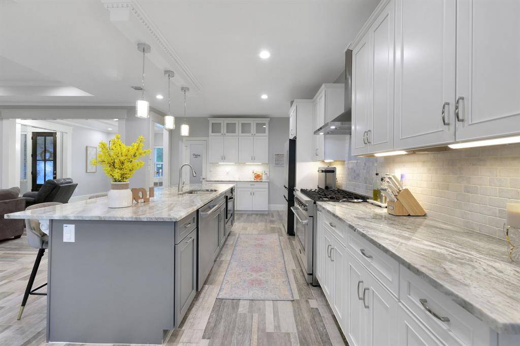 This perspective captures the seamless transition from the kitchen to the elegant butler’s pantry, adding both function and flow to the home’s design.