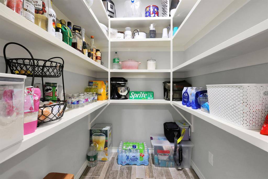 An oversized pantry offers abundant storage—perfect for the chef in the family and all your culinary essentials.