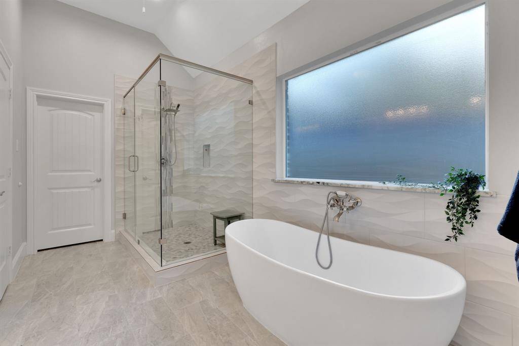 With its graceful lines and calming presence, this soaking tub adds a touch of everyday luxury to the primary bath.