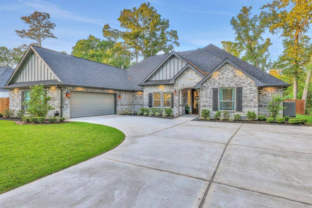 The generous driveway provides plenty of parking, making hosting and daily living a breeze.