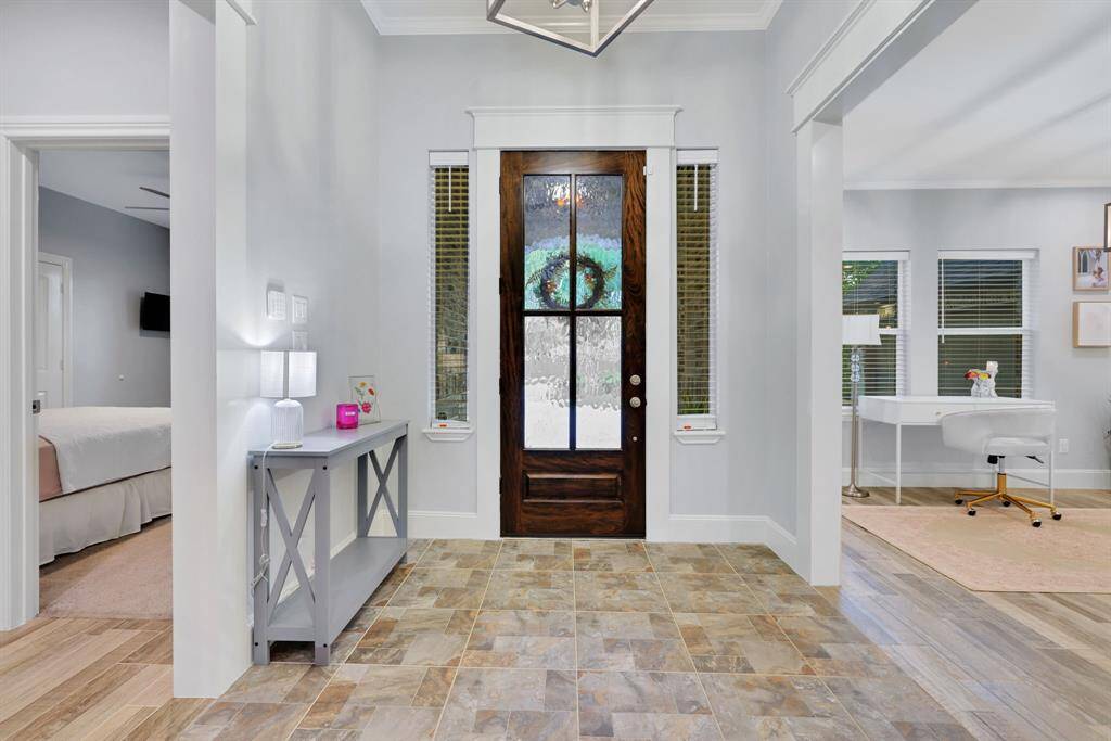 Welcoming open-concept entry with a versatile dining/flex room on the left.