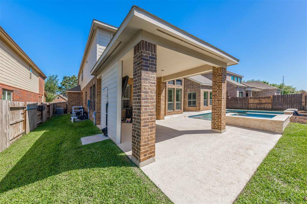 Notice the outdoor shower for an easy rinse after a dip in the pool!