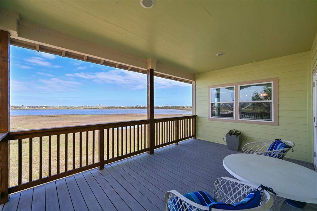 Enjoy your morning coffee, dining al fresco, or an evening nightcap on this breezy balcony located just off of the dining area. You can see the #3 tee box of the Moody Garden golf course and the wetlands of Sydnor Bayou that meander into Offats Bayou and then Galveston Bay.