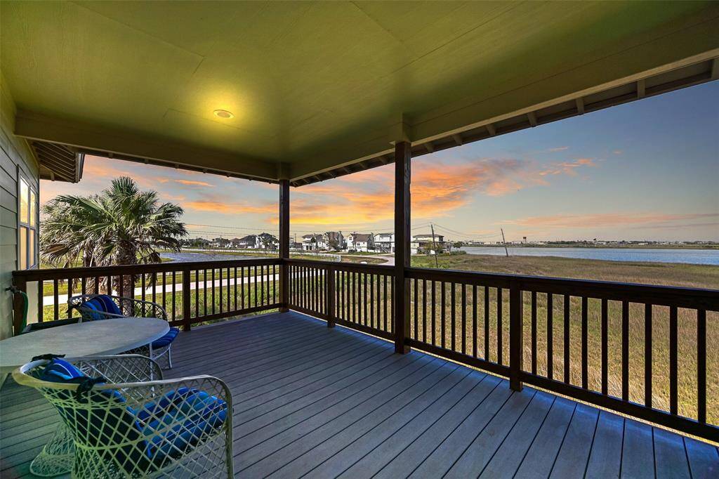 Enjoy your morning coffee, dining al fresco, or an evening nightcap on this breezy balcony located just off of the dining area. You can see the #3 tee box of the Moody Garden golf course and the wetlands of Sydnor Bayou that meander into Offats Bayou and then Galveston Bay.
