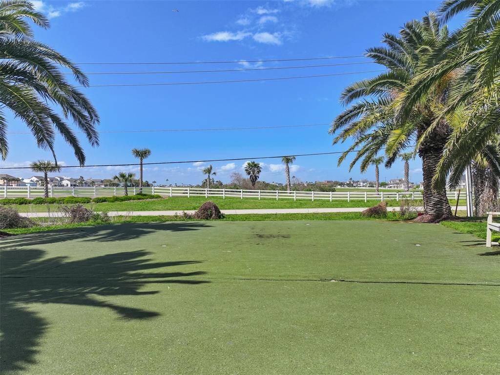 The quaint and quiet Campeche Shores community has amenities that include a pier with a gazebo, a concrete grilling area with a fire pit and seating, and this recreational putting green for you to enjoy at your leisure - all just a short stroll from the house.