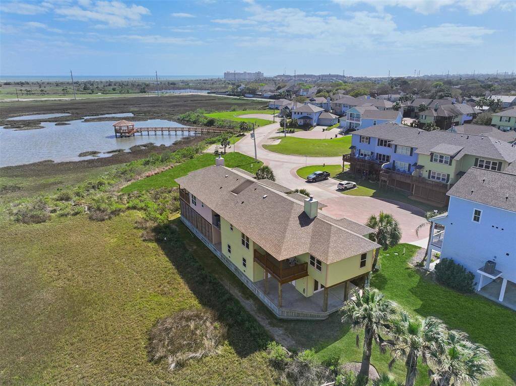 Zooming out a little further from the home, notice the HOA-owned greenspace in the front right quadrant that adjoins this property - your views will never be obstructed! Also note the close proximity of the pier, gazebo, and fire pit area just steps from the house.