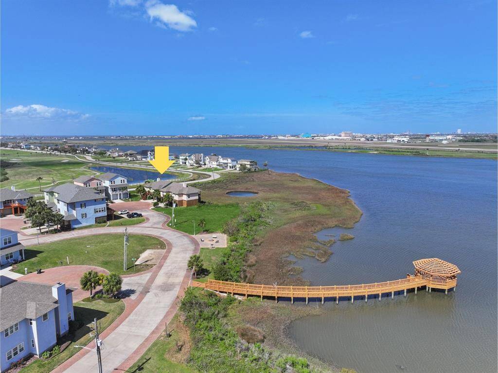 An aerial view looking to the north highlights the great location with quick and easy access to the heart of Galveston, but seclusion from the hustle and bustle of vacationers. Just across Sydnor Bayou, you'll see Schoals Airport, Moody Gardens, and Schlitterbahn Waterpark.