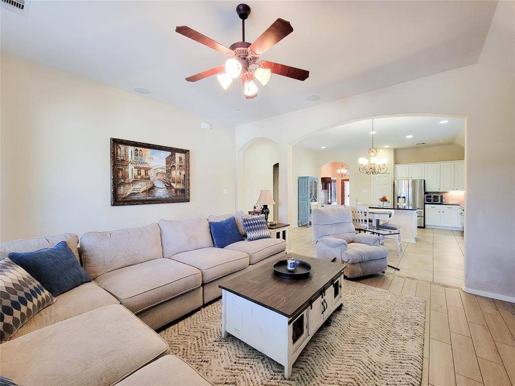 The living room flows seamlessly to the rest of the home