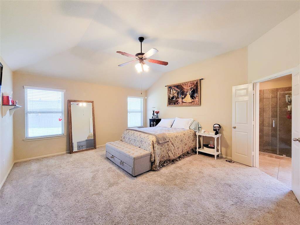 Spacious Primary Bedroom with double doors leading to the restroom