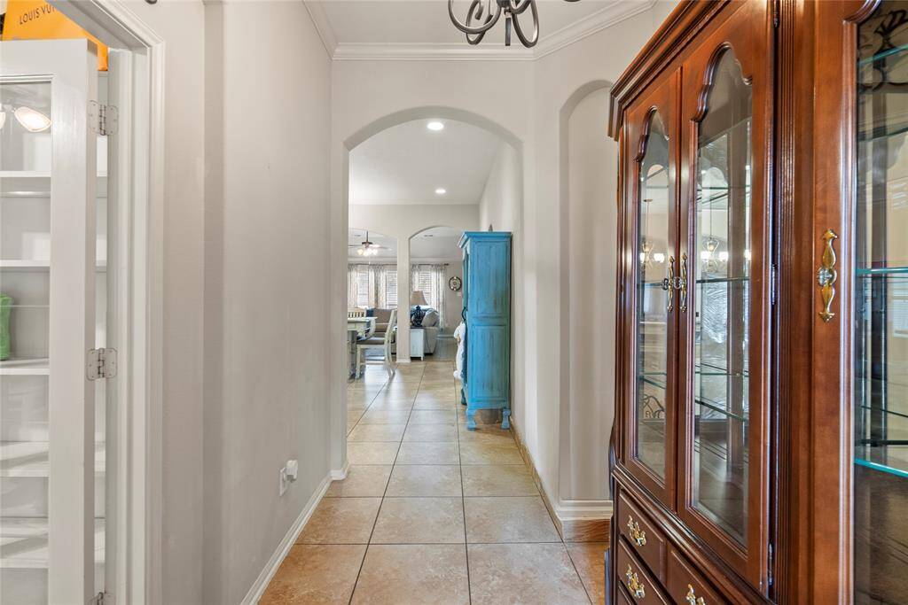 Upon entering the foyer, you will be greeted by high ceilings and French doors leading to the home office