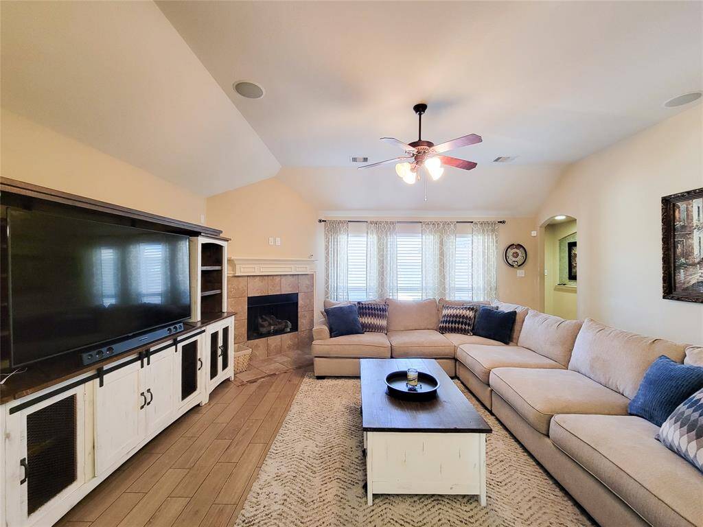 The wood like tile along with the gas log fire place calls for cozy movie nights!