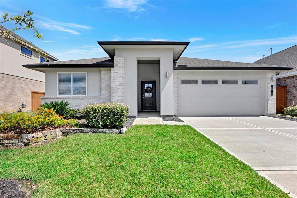 This home features a stunning brick & stucco exterior.