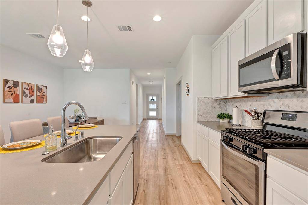 You'll simply love the kitchen layout, featuring a thoughtfully designed space for effortless meal preparation.
