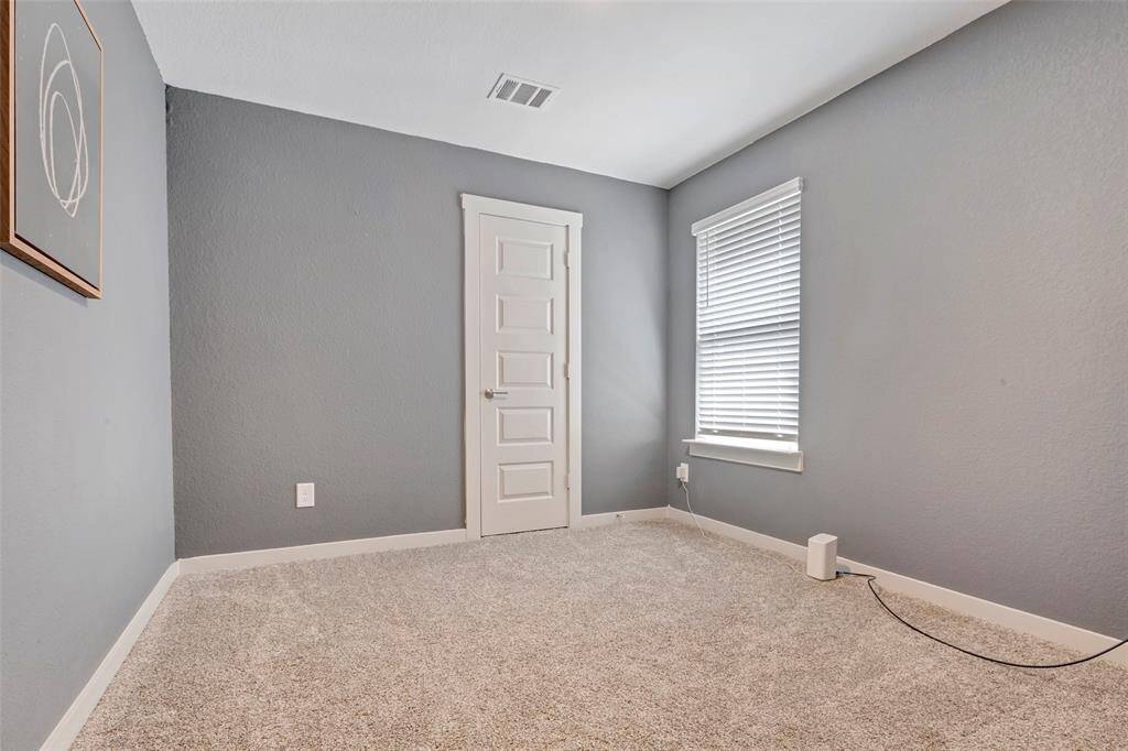 This secondary bedroom is a blank canvas, inviting you to unleash your artistic side as you decorate and personalize the space to your taste.