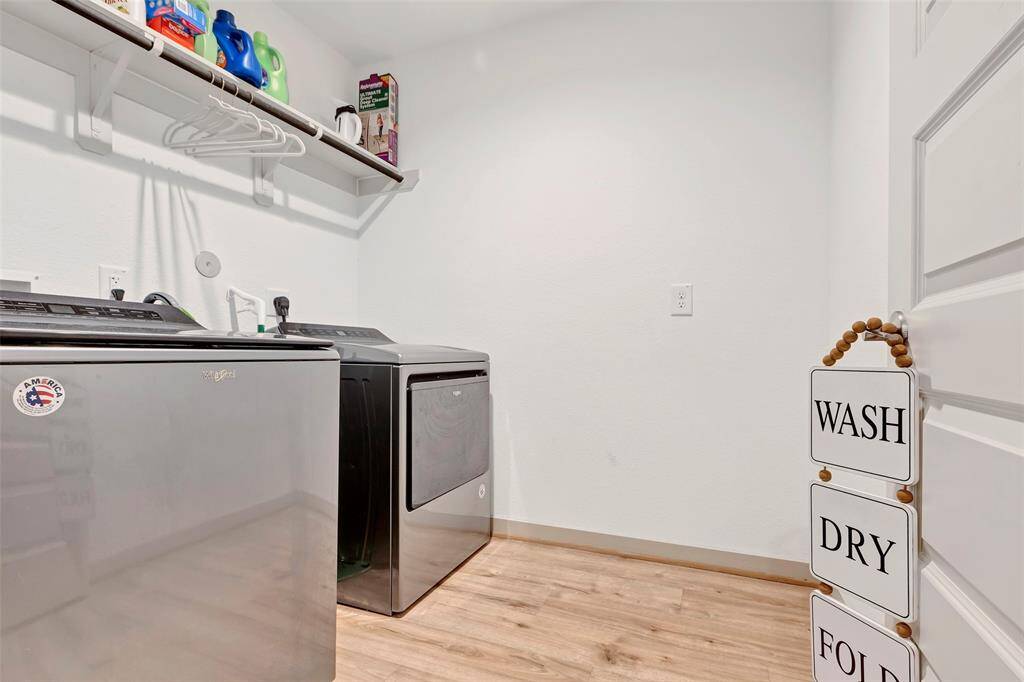 This laundry room is equipped with gas dryer and washer connections, providing convenience and efficiency for your laundry needs.