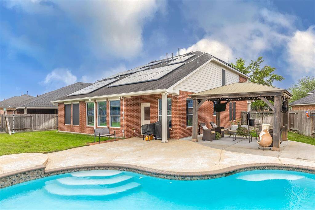 Big backyard with a beautiful pool and pergola!