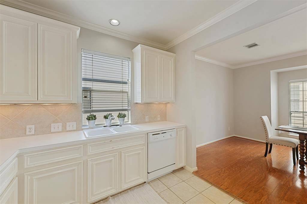 Kitchen with double sinks and walk in pantry.