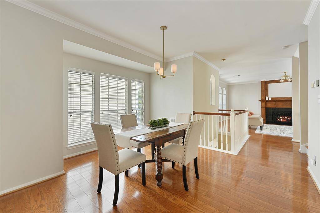 Dining open to the main living area with new decorative chandelier.