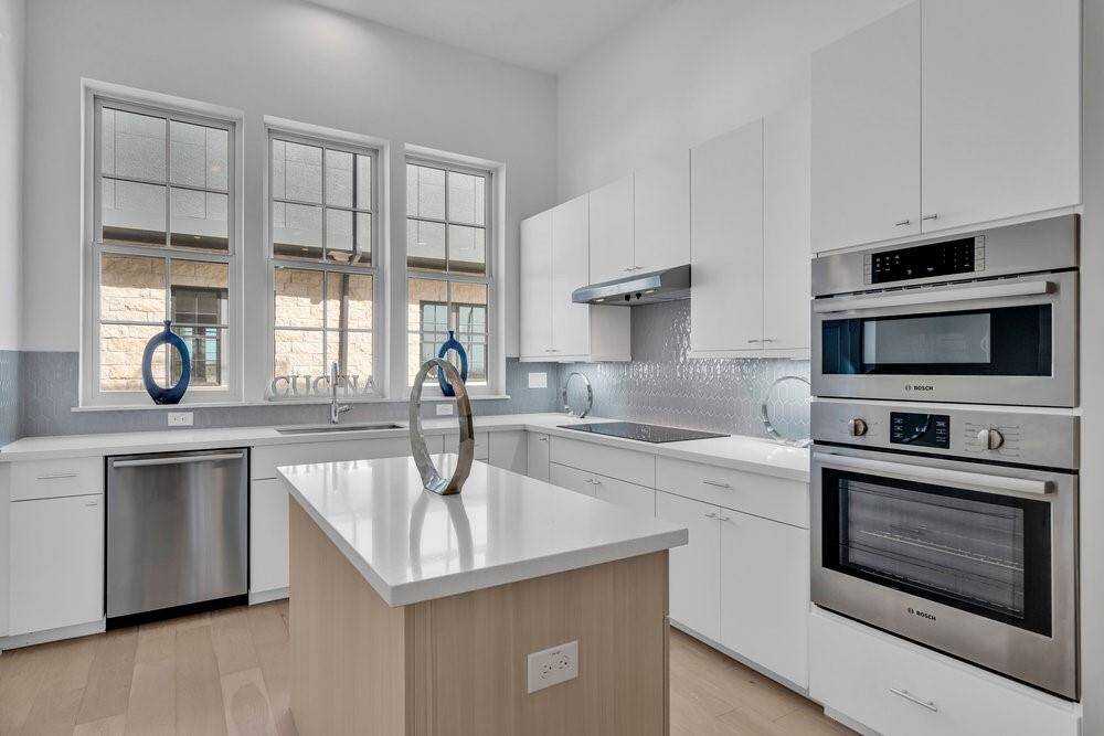 Similar plan and finishes.  Actual home has upgraded appliances.  Fisher and Paykel appliances with double drawer dishwasher and convection oven.