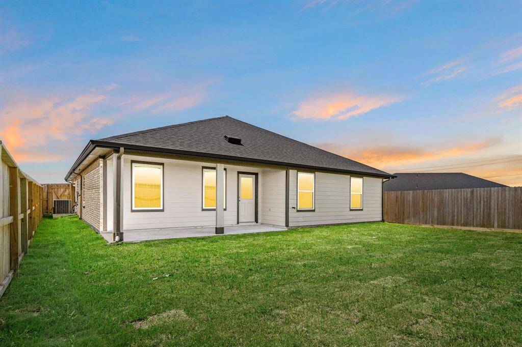 Come and see this spacious backyard with its beautiful covered patio. There is plenty of room for the kids to play and adults to relax!
