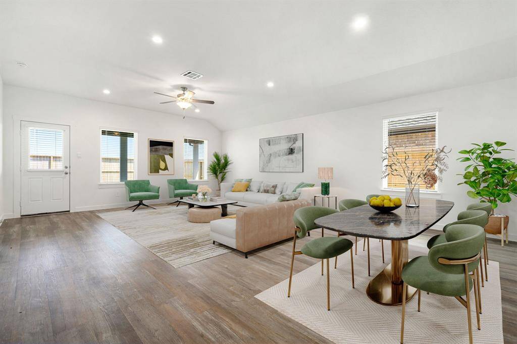 This light and bright spacious living room is the perfect layout for entertaining or just relaxing. Whether it's simply a night in or entertaining family and friends, this home has ample open space for everyone to enjoy! Featuring luxury vinyl plank flooring, large windows, high ceilings, recessed lighting with wonderful access to your gorgeous kitchen and patio.