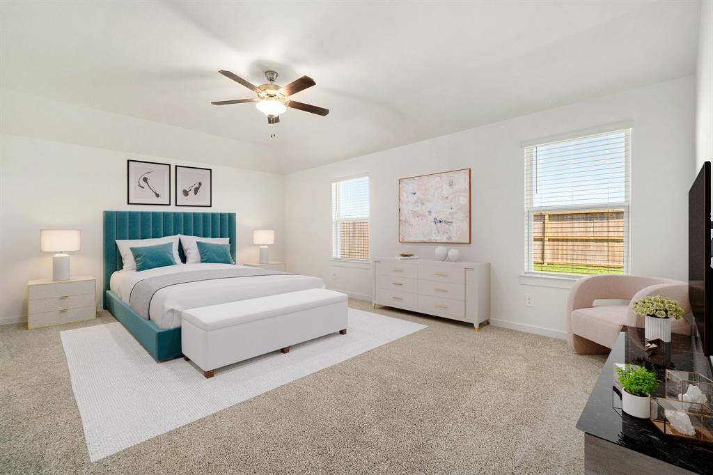 What a wonderful place to come home to, this stunning primary suite greets you with gorgeous plush carpet floors, high ceiling, lovely windows allowing in natural light brightening up this spacious primary bedroom, with extra space for a seating area.