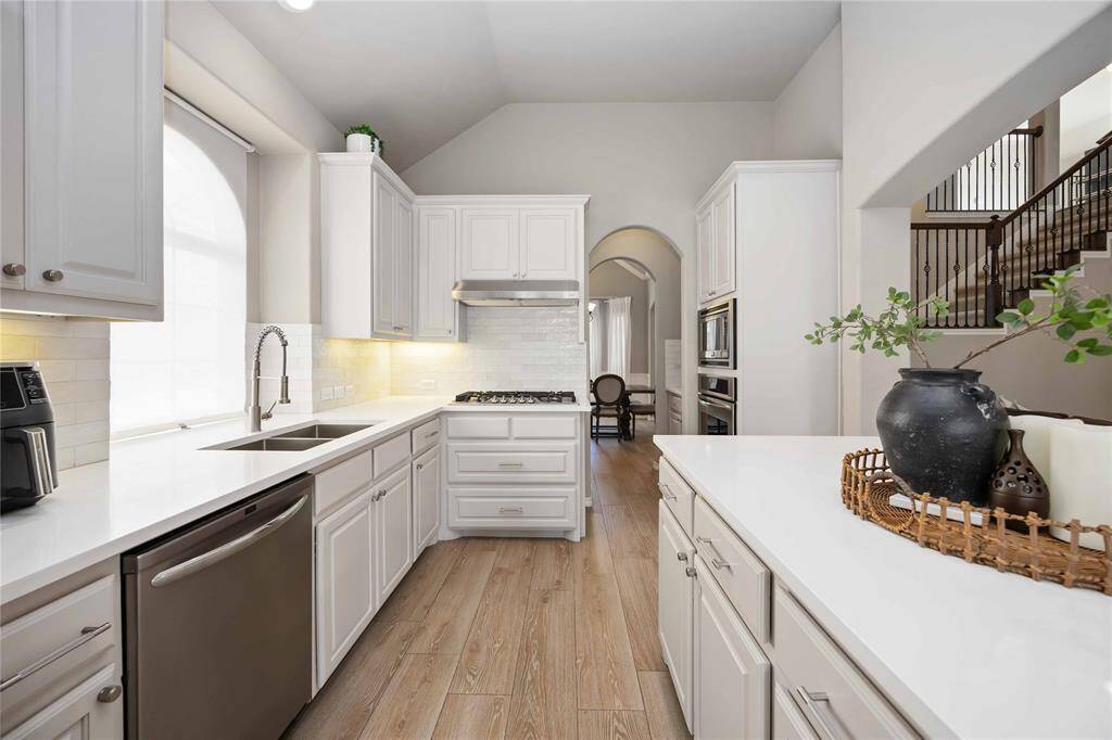 A seamless view from the kitchen into the butler’s pantry — combining functionality and flow with elevated design details.