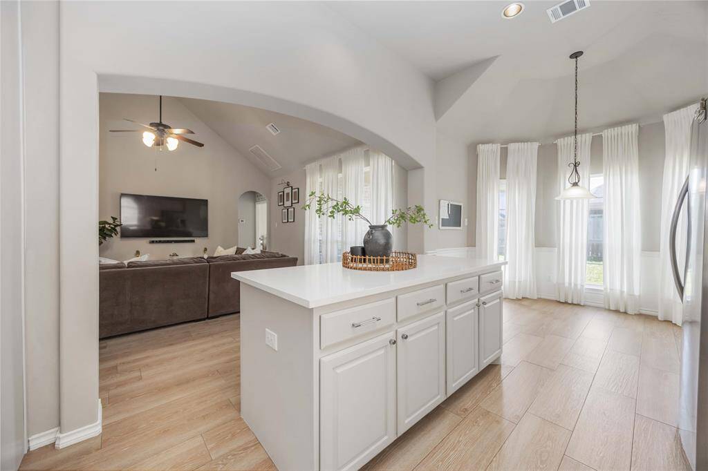 Spacious kitchen with a clear view into the open living area, offering easy flow and a connected feel throughout the heart of the home.