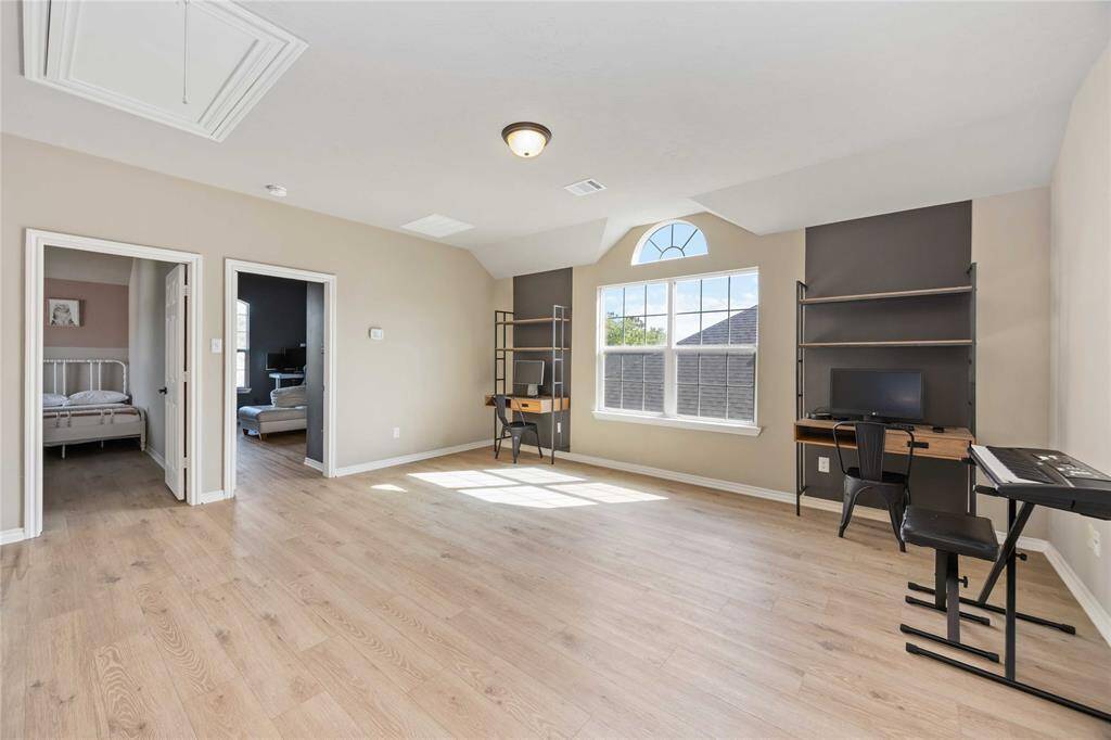 Spacious game room loft with endless potential — perfect for homeschooling, a media lounge, creative space, or whatever fits your lifestyle.