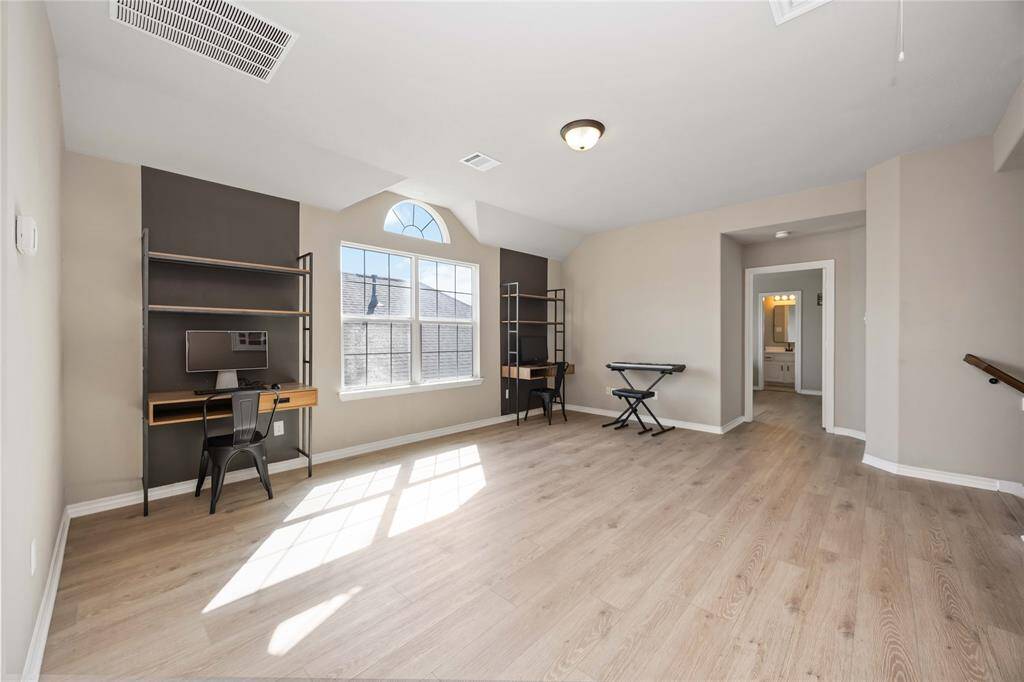 Another view of the game room loft showcases its open layout and flexibility — a bright, inviting space ready to adapt to your needs.