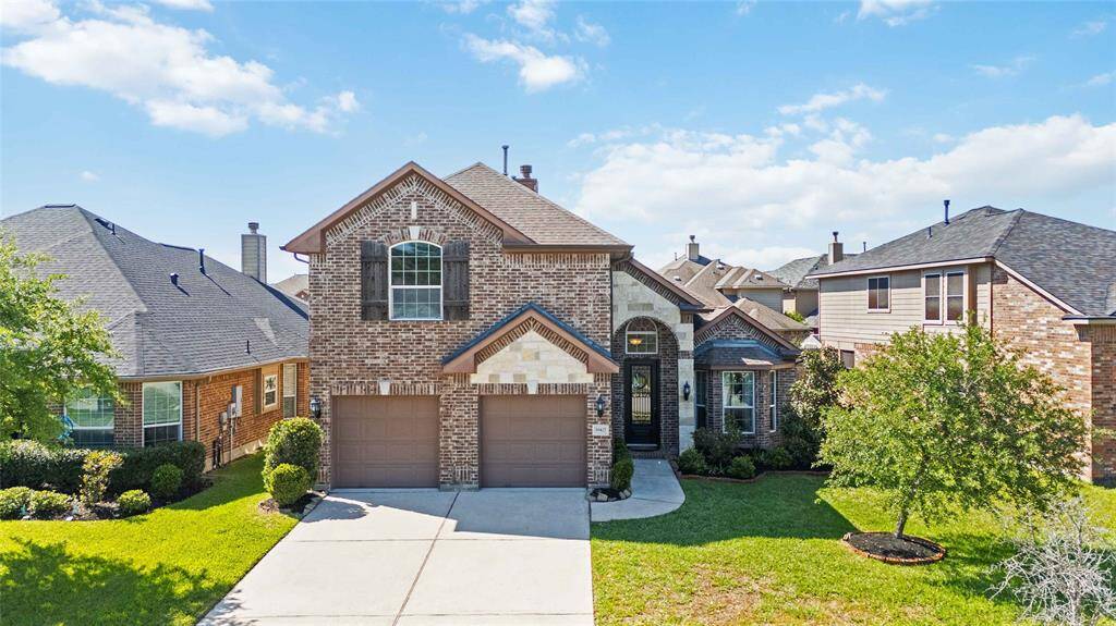 Charming brick and stone exterior set within an inviting neighborhood — blending timeless curb appeal with a warm, welcoming community feel.