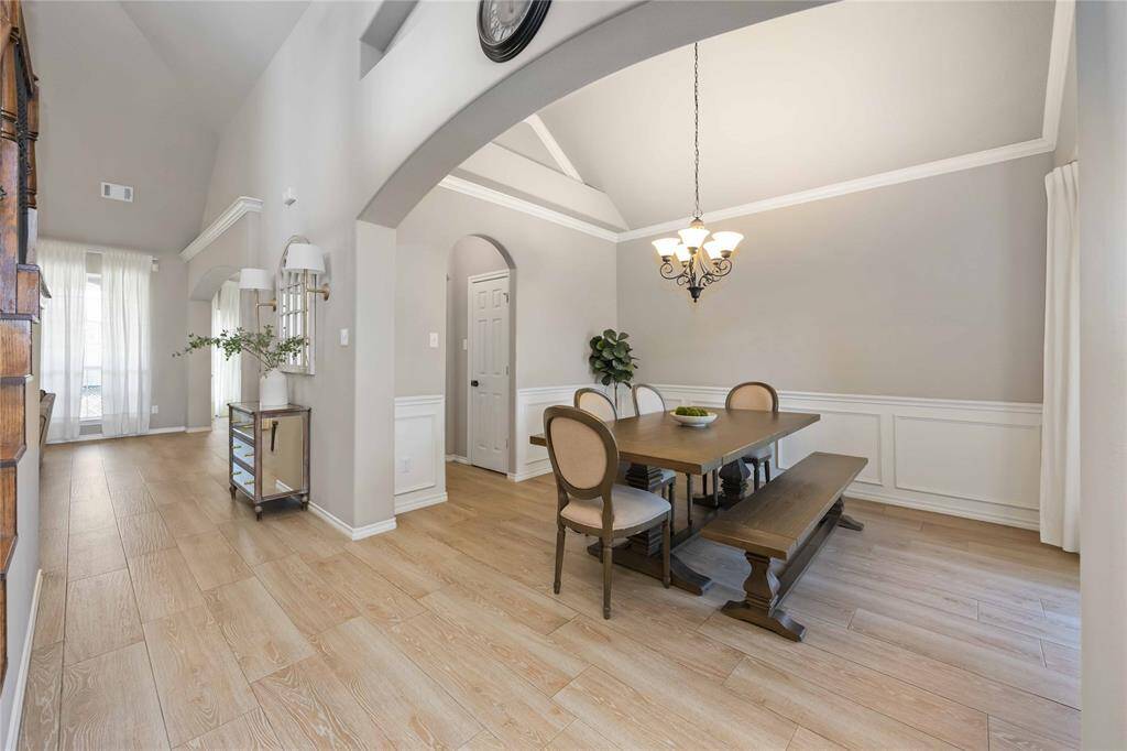 An elegant, traditional formal dining area that seamlessly flows into the Butler’s Pantry — perfect for hosting with style and ease.