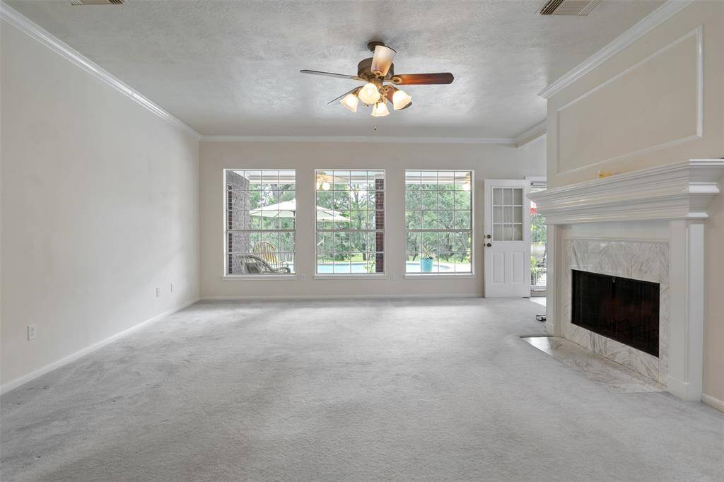 This home features an incredible family room with everything you could want—abundant natural light, stunning views of Chigger Creek, and a serene oasis-like backyard. On chilly nights, cozy up by the warm fireplace and enjoy the perfect blend of comfort and tranquility.